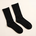 LYNE Mid-Tube Socks in Black, pair flat lay