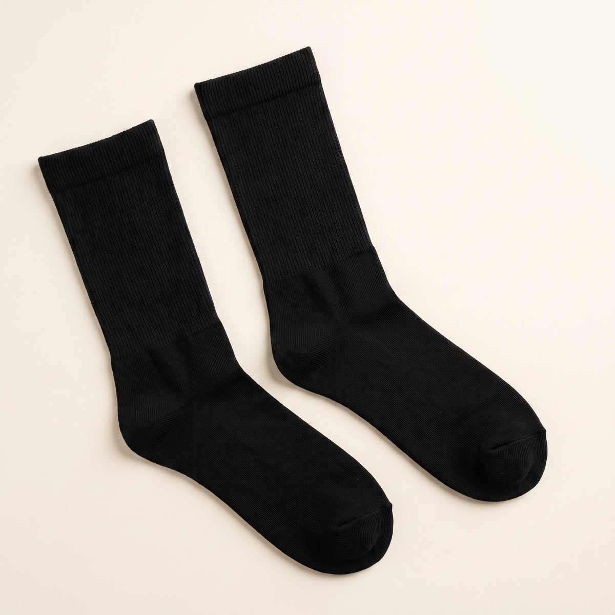 LYNE Mid-Tube Socks in Black, pair flat lay