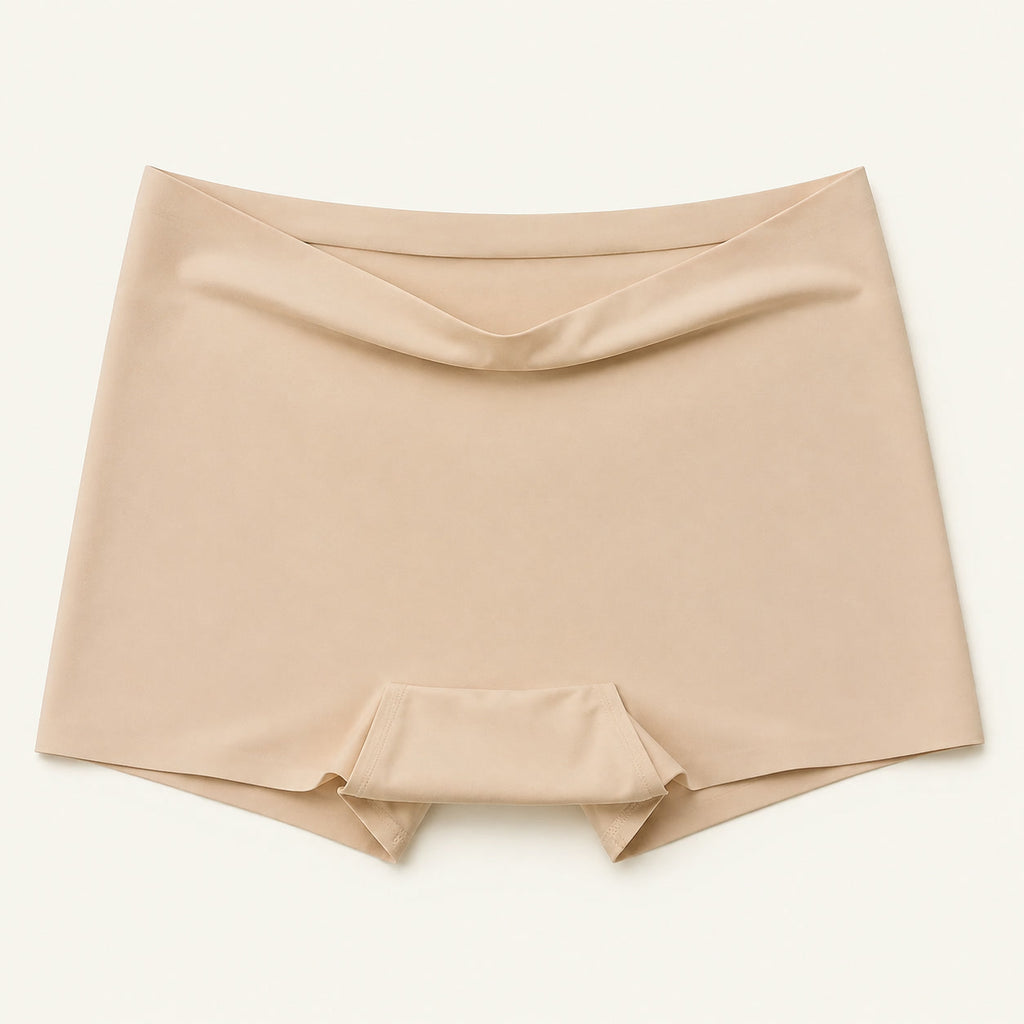 LYNE Under-Dress Safety Short in Nude, flat lay showing the narrow self-fabric top edge and gusset