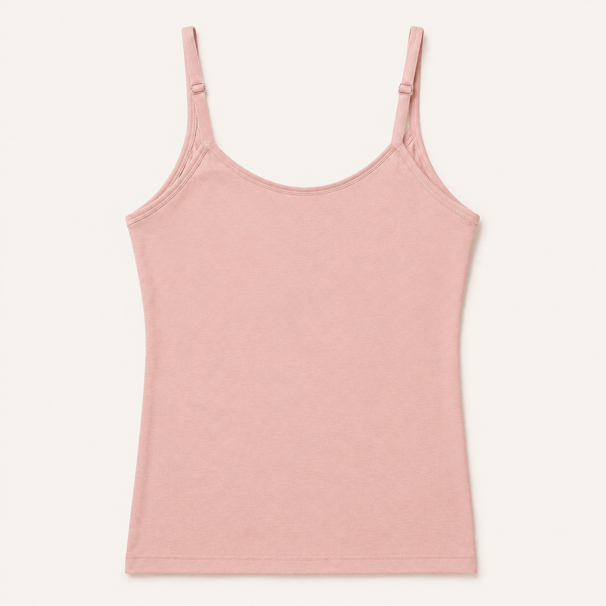 Pink bra-free camisole with narrow adjustable straps and a smooth outer finish