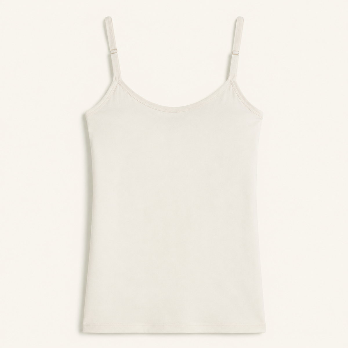 White bra-free camisole with narrow adjustable straps and a smooth outer finish