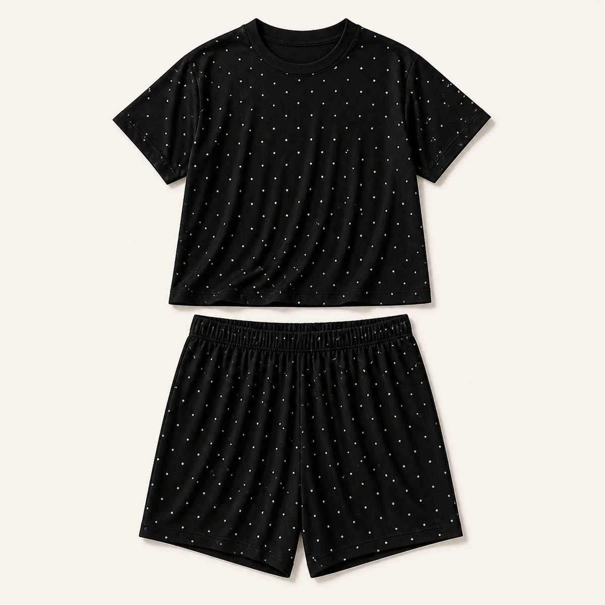 Black polka dot pyjama set: short-sleeve top and matching shorts in a soft rayon knit