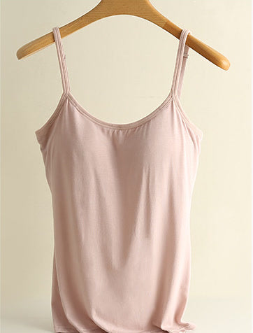 Pink bra-free camisole on a hanger: smooth outer front, narrow adjustable straps (supplier photograph)