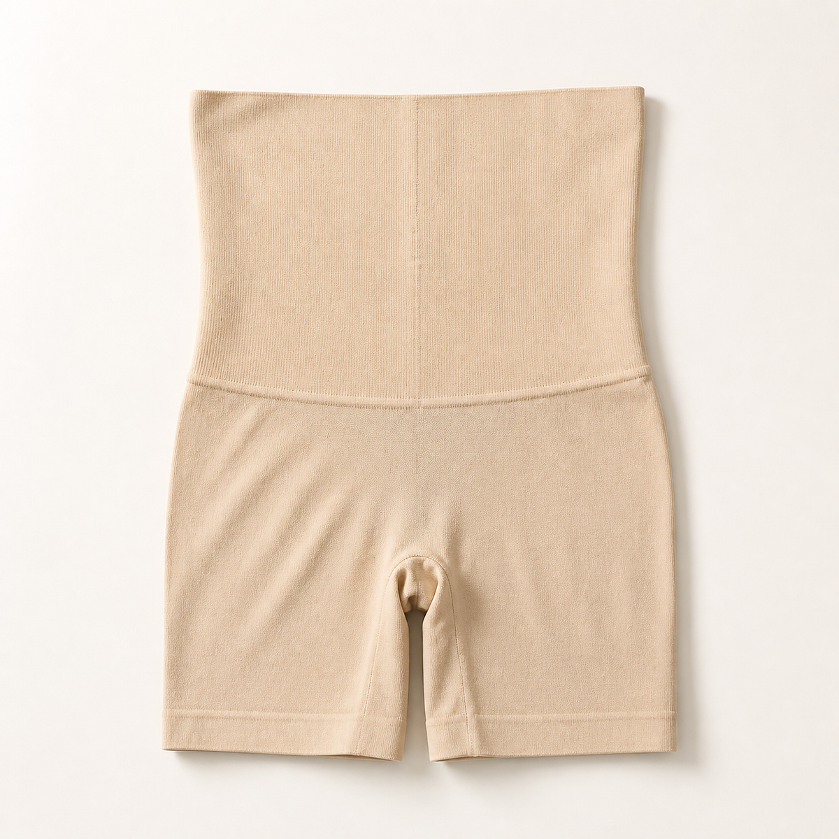 LYNE Core Sculpt Short folded flat, showing the high tummy panel and its flat bonded top edge