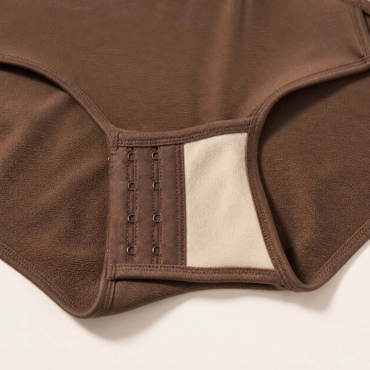 LYNE Core Seamless Bodysuit, hook-and-eye gusset opening and cotton lining detail