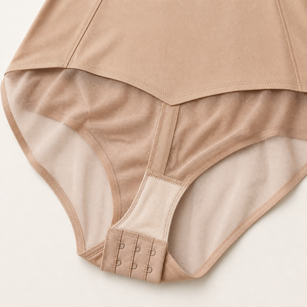 LYNE Core Mesh Bodysuit, where the sheer mesh seat meets the opaque knit, and the hook-and-eye gusset