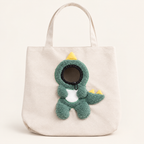 Ivory Dino pet tote with green dinosaur details and yellow spikes