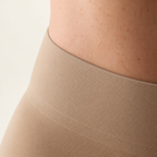 LYNE Core Sculpt Short worn, the high tummy panel sitting flat against the skin